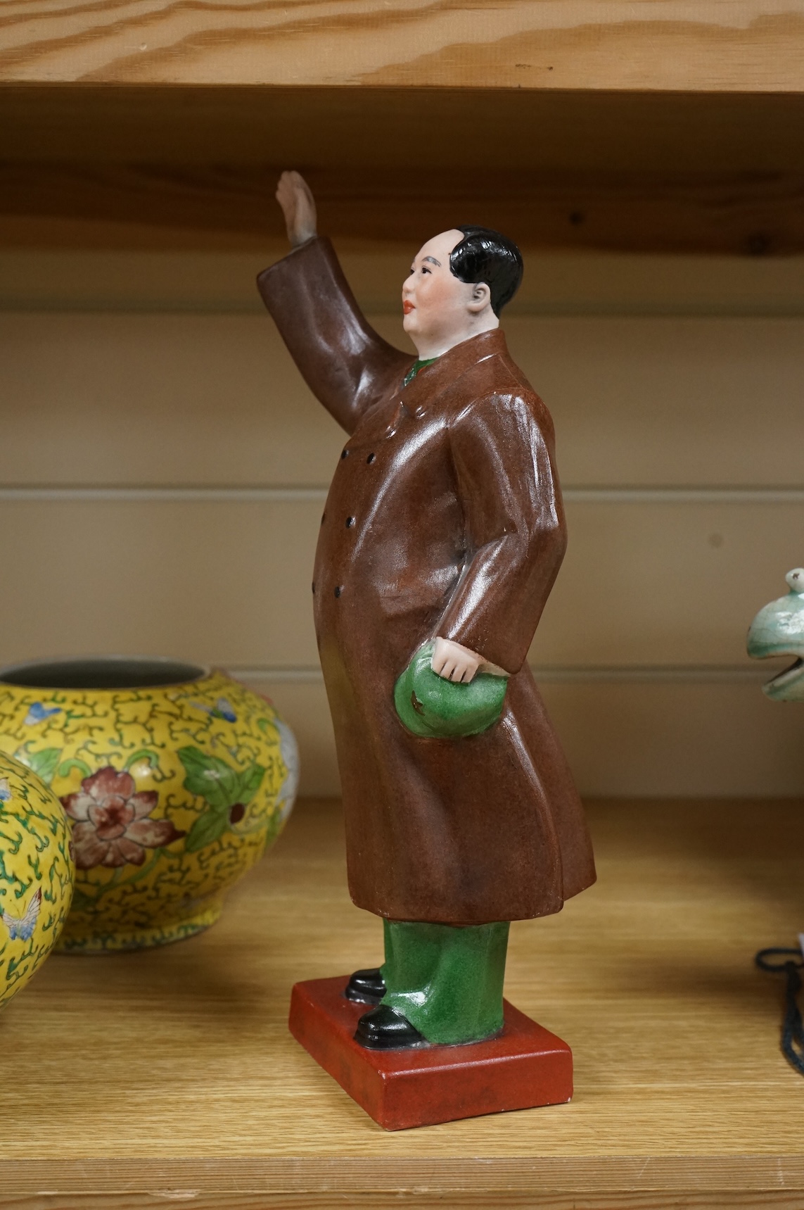 A Chairman Mao porcelain figure and a pair of Chinese yellow ground bowls decorated with flowers and insects, largest 30cm high